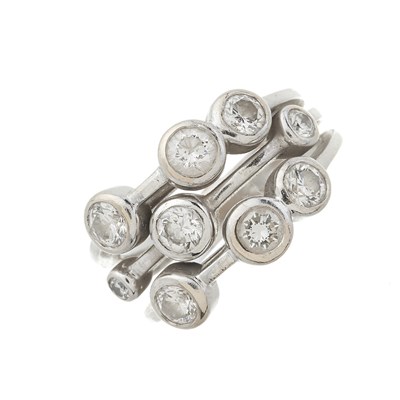 Lot 46 - An 18ct gold diamond three-row band ring