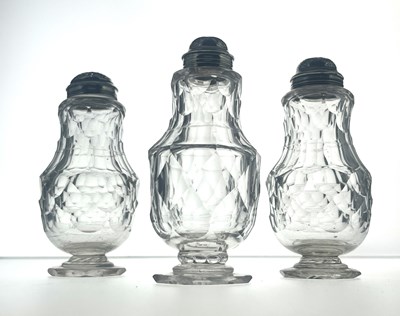 Lot 77 - Three silver mounted facet cut glass condiment shakers
