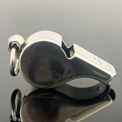 Lot 132 - A George V silver whistle, of conventional...