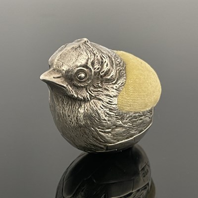 Lot 116 - An Edwardian novelty silver pin cushion, of...