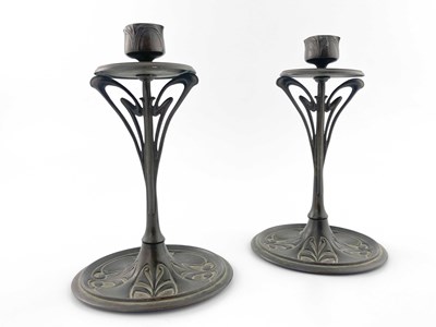 Lot 135 - A pair of bronze Art Nouveau candlesticks,...
