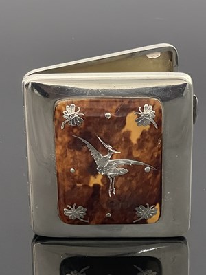 Lot 34 - A George V silver and tortoiseshell cigarette...