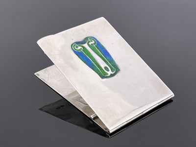 Lot 114 - Archibald Knox for Liberty and Co., an Arts and Crafts silver and enamelled notepad case