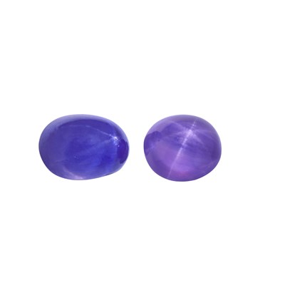 Lot 385 - A natural star sapphire cabochon, together...
