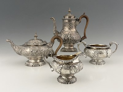 Lot 46 - A George III/IV silver matched four-piece tea...