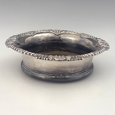 Lot 81 - An Elizabeth II silver wine coaster, Harrods...