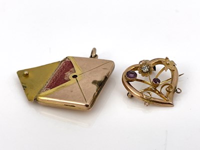 Lot 12 - A 9 carat gold combination envelope stamp case...