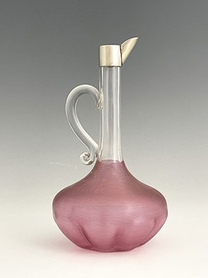 Lot 68 - An Edwardian silver-mounted cranberry threaded...