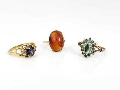 Lot 19 - Three gold and gem set rings, including emeral...