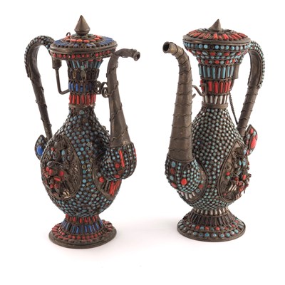 Lot 5 - A pair of Persian white metal and jewelled...
