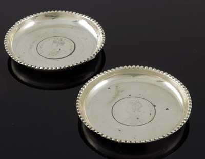 Lot 6 - A pair of Anglo Indian silver coin set dishes,...