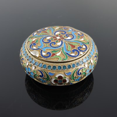 Lot 21 - A Russian silver gilt snuff box, of circular...