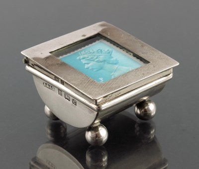 Lot 101 - A Victorian silver stamp moistener and an...