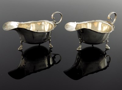 Lot 109 - A pair of George V silver sauce boats, Asprey...