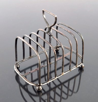 Lot 119 - A Victorian silver six division toast rack,...