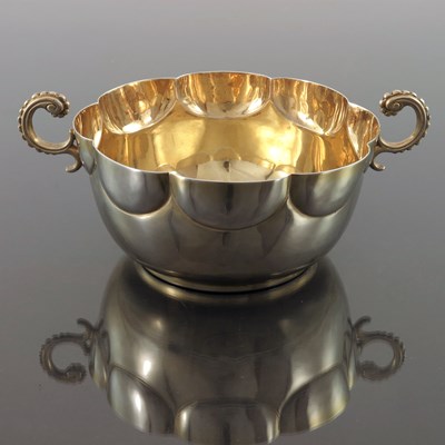 Lot 128 - An Edwardian silver gilt twin handled bowl,...