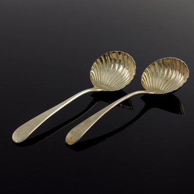 Lot 134 - A pair of George III silver sauce ladles,...