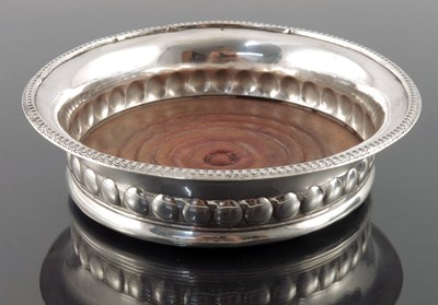 Lot 149 - A George III white metal wine coaster, circa...