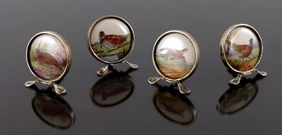 Lot 156 - A set of four Edwardian silver menu holders of...