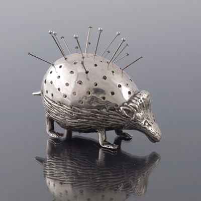 Lot 164 - An Edwardian novelty silver pin cushion,...