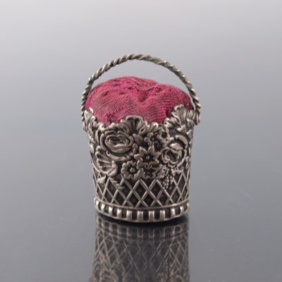 Lot 194 - A Victorian novelty white metal pin cushion,...