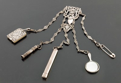Lot 237 - An Edwardian silver chatelaine, Reynolds and...