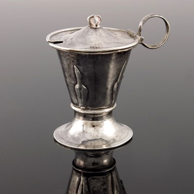 Lot 276 - A E Jones, an Arts and Crafts silver mustard...