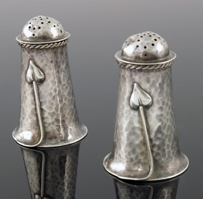 Lot 277 - A E Jones, a pair of Arts and Crafts silver...