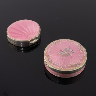 Lot 293 - A pink guilloche enamel circular powder...