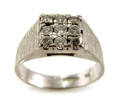 Lot 306 - An 18ct gold brilliant-cut diamond cluster...