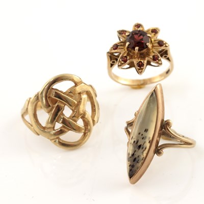 Lot 309 - Three 9ct gold gem-set rings, to include a...