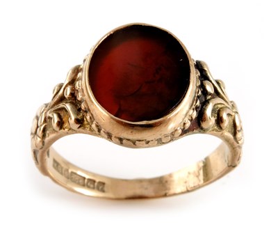 Lot 312 - A 1970s 9ct gold orange gem signet ring, with...