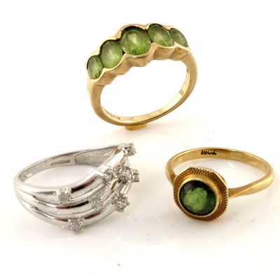 Lot 314 - Three gold, peridot and diamond rings, to...