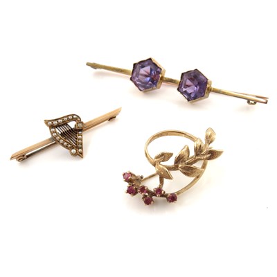 Lot 315 - Three gold gem-set brooches, to include a...