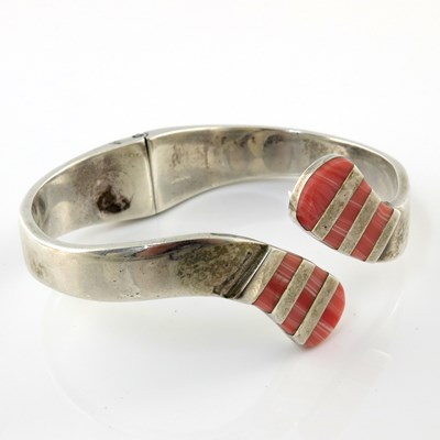 Lot 333 - A Mexican silver hinged bangle, with pink gem...