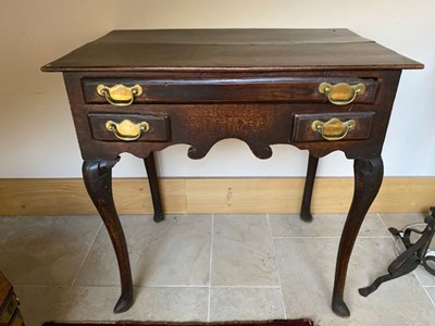 Lot 342A - A George II country oak lowboy, circa 1750,...
