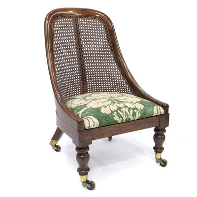 Lot 343 - A Regency rosewood fireside bergere chair,...