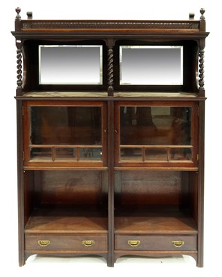 Lot 369 - An Aesthetic Movement walnut mirror backed...