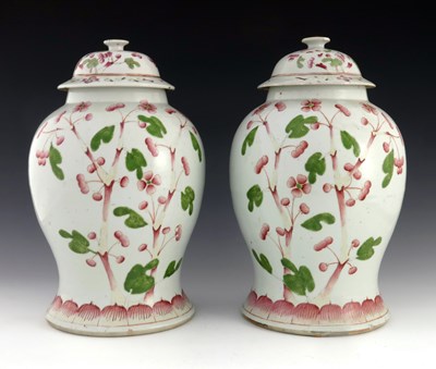 Lot 428 - A pair of Chinese famille rose temple jars and...