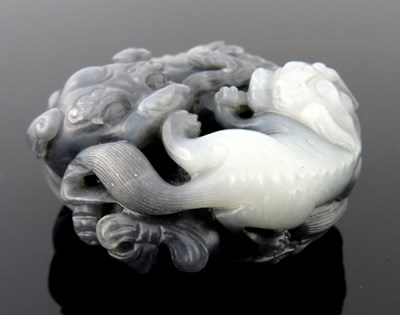 Lot 469 - A Chinese black and white jade pendant carving,...