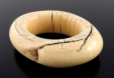 Lot 519 - ? An African tribal ivory bangle bracelet,...