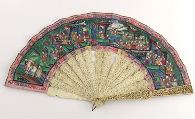 Lot 521 - A mid 19th Century Chinese fan, open fretwork...