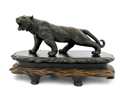 Lot 531 - A Japanese bronze study of a prowling tiger,...