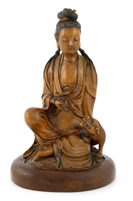 Lot 542 - A Chinese carved hardwood figure of Guanyin,...