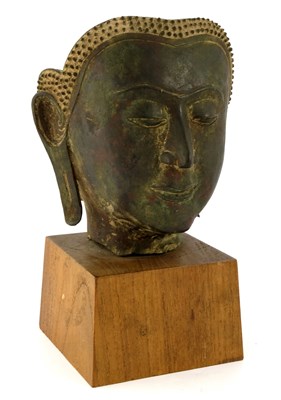 Lot 544 - A bronze sculpture of a Buddha head, Thailand,...