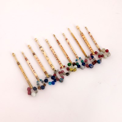 Lot 586 - Ten 19th Century spot name inscribed bone lace...