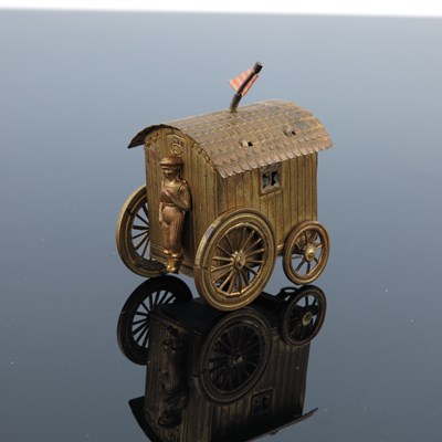 Lot 590a - A novelty gilt brass tape measure in the form...
