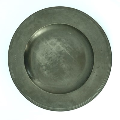 Lot 666 - A Charles II broad-rimmed pewter charger,...