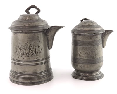 Lot 677 - A pewter lidded pint and 1/2 pint measures,...