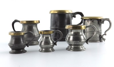Lot 679 - A group of six 19th Century brass rim measures,...